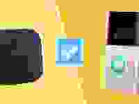 A Blink camera and Ring doorbell on a yellow background with a blue checkmark in between