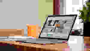 An open and powered on laptop displaying a website on its screen