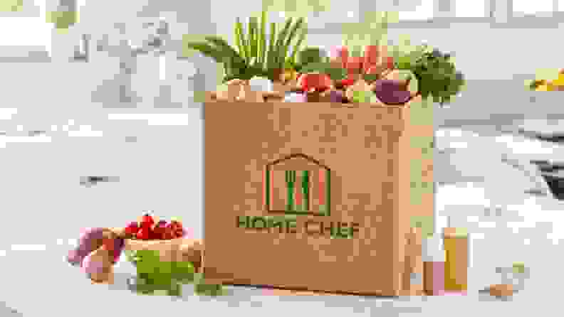 A Home Chef meal kit box sits on a counter.