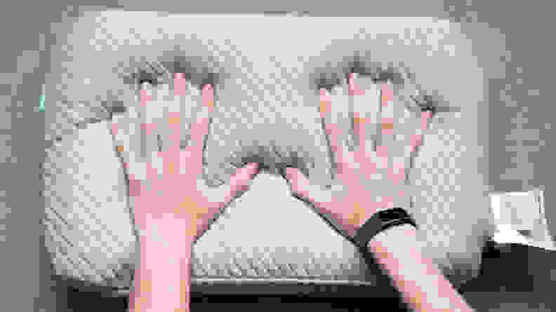 hands push into the Leesa pillow foam