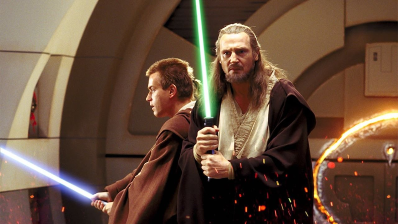 Qui-Gon Jinn and Obi-Wan Kenobi holding lightsabers