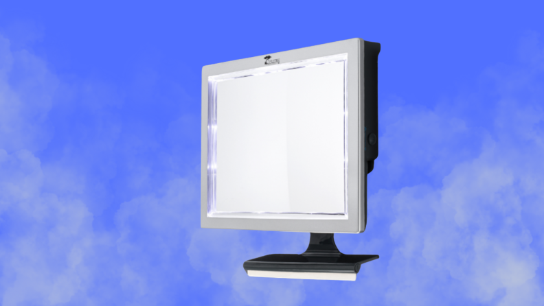 A shower mirror sits on a steamy blue background background