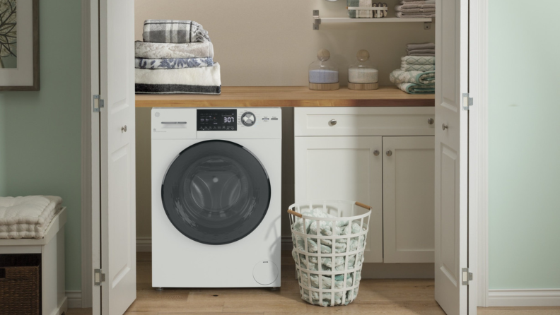 The GE GFQ14ESSNWW in a laundry closet.