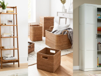 A midcentury modern bookcase, stacks of woven baskets, and a white cabinet.